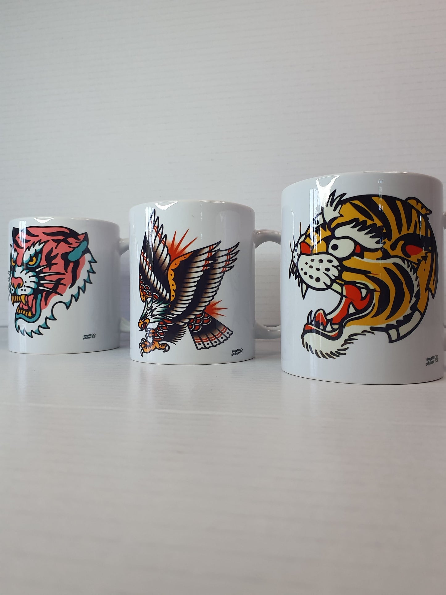 Pack de 3 tazas estilo old school con diseños retro tradicionales: tigres tradicionales y aguila.

