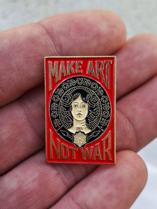 Pin estilo Old School – Haz Arte No Guerra, rojo y dorado.