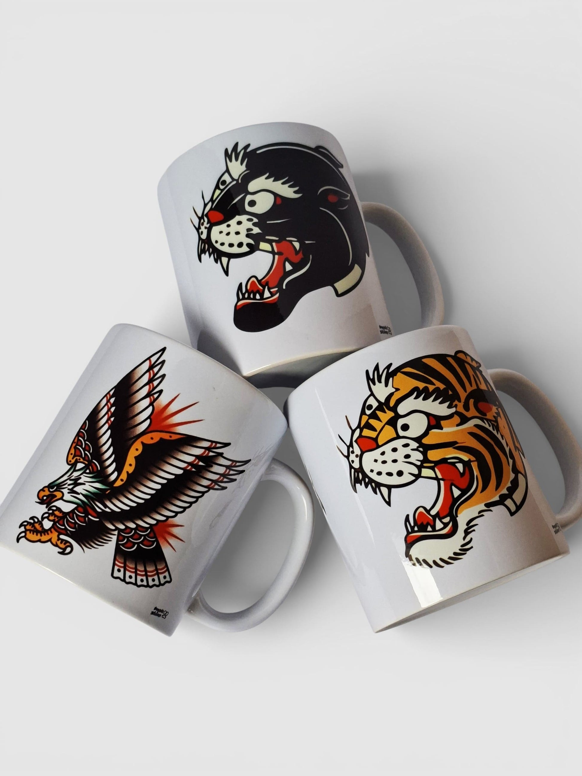 Tazas old school con diseño de agúila, tigre y pantera, estilo tradicional americano.
